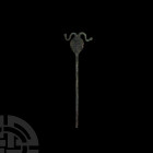 Twin Serpent-Headed Pin. 1st millennium B.C. A pin composed of a round-section stem and flat-section oval-shaped body, finial formed as two serpents, ...
