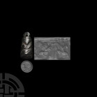Barrel-Shaped Stamp Seal Pendant. c.10th-7th century B.C. A black limestone stamp seal pendant with incuse motif to base of a winged quadruped advanci...