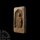 Chinese Northern Wei Buddha Brick. Northern Wei Dynasty, 386-534 A.D. A ceramic rectangular brick with high-relief figure of Buddha standing facing, w...