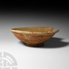Chinese Song Green Glazed Dish. Song Dynasty, 14th-16th century A.D. A patella-shaped dish with rolled rim and shallow foot; remains of green glaze. 4...