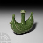 Chinese Ottoman Style Green Glazed Vessel. 20th century A.D. or earlier. A crescentic green-glazed vessel with conical terminals and central cylindric...