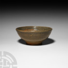 Chinese Song Bowl. Song Dynasty, 960-1279 A.D. A ceramic bowl with celadon glaze, gently tapering D-section body, shallow foot. 445 grams, 15 cm wide ...