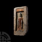 Chinese Wei Buddha Brick. Wei Dynasty, 534-550 A.D. A rectangular ceramic brick with rectangular recess featuring a standing Buddha beneath a canopy i...