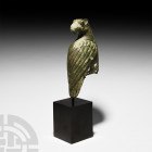 Chinese Eagle Mount. 19th century A.D. or earlier. A large bronze eagle in Han Style with head looking backwards, curving beak and large expressive ey...