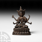 Sino-Tibetan Gilt Seated Avalokitesvara Figurine. 19th-20th century A.D. A hollow-formed gilt-bronze figurine of Avalokite?vara sitting cross-legged o...