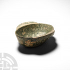 Chinese Han Stoneware Bowl. Han Dynasty, 206 B.C.-220 A.D. A boat-shaped stoneware bowl with two handles and remains of a glaze. 240 grams, 14.1 cm wi...