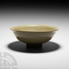 Chinese Song Glazed Bowl. Song (or Yuan) Dynasty, 960-1368 A.D. A green-glazed ceramic bowl with D-section wall, everted rim and shallow foot. 480 gra...