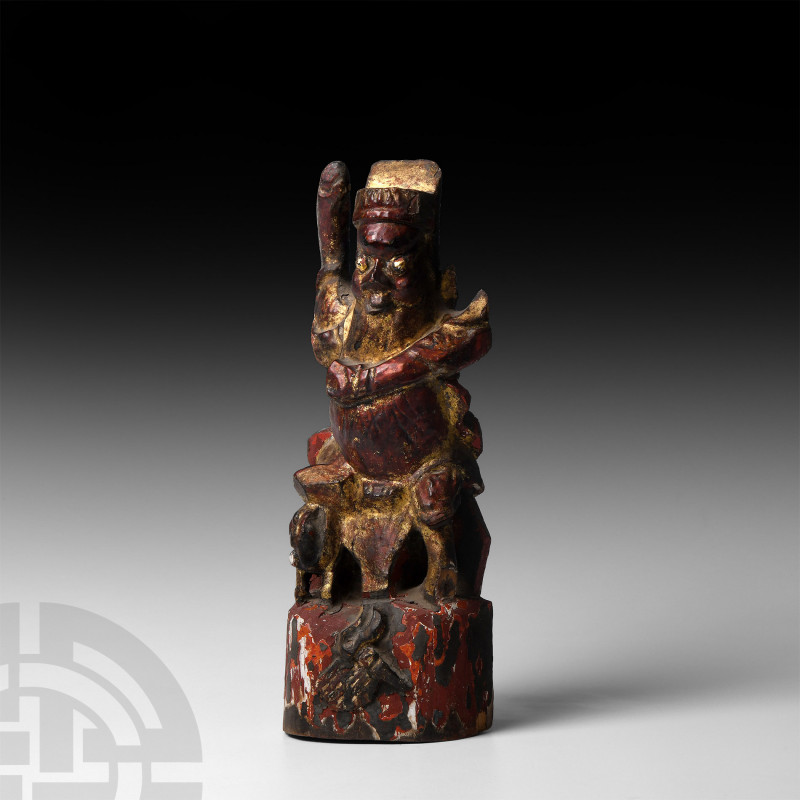 Chinese Gilt Wooden Figure. 20th century A.D. A carved wooden votive figure mode...