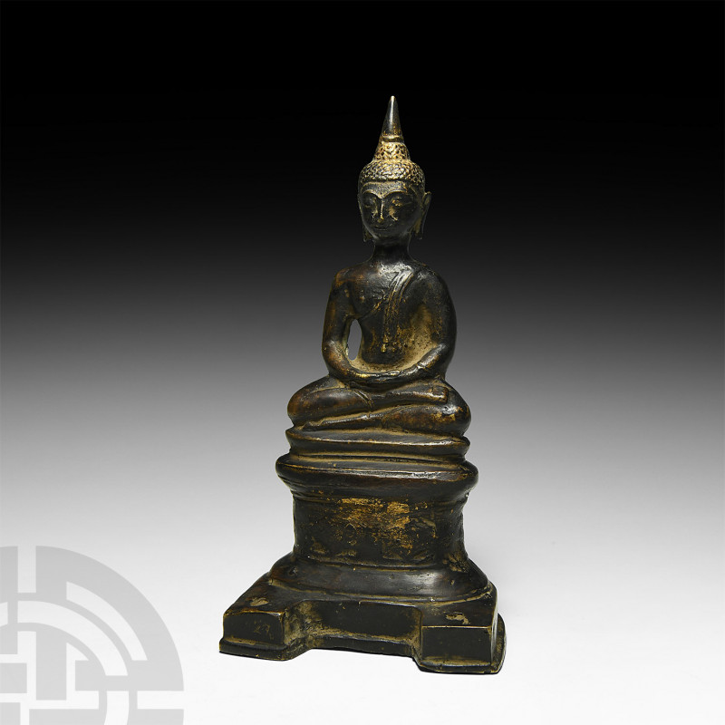 Thai Gilt Seated Buddha. 19th-20th century A.D. A gilt-bronze statuette of Buddh...