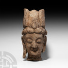 Chinese Stone Head of Bodhisattva. Northern Wei Dynasty, 386-534 A.D. or later. A sandstone head of a Bodhisattva with serene expression, rounded chee...