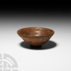 Chinese Song Tea Bowl. Song Dynasty, 960-1279 A.D. A conical ceramic bowl with a mottled glaze to the upper body, shallow foot. 165 grams, 11.7 wide (...