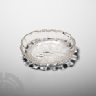 Mughal Style Rock Crystal Dish. 20th century A.D. A rock crystal dish, oval in plan with a scalloped rim, engraved band of geometric flowers around th...