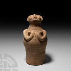 Indus Valley Cylindrical Fertility Figure. c.3300-1300 B.C. A ceramic fertility figure composed of a bell-shaped body and squat head, arms cupping con...