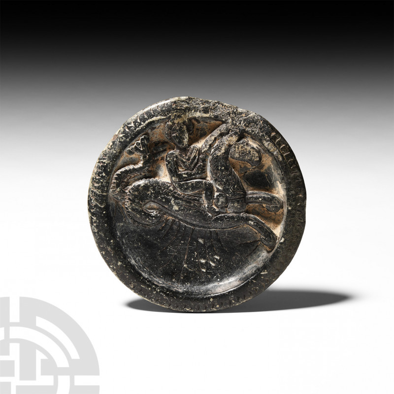 Gandharan Roundel with Hippocamp and Rider. c.1st-3rd century A.D. A carved schi...