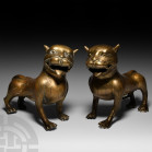 Indian Standing Tiger statue Pair. 20th century A.D. A pair of stylised bronze mustachioed tigers, cast in the round with open mouths baring teeth and...