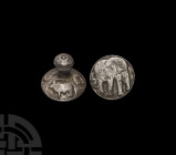 Moghul Silver Stamp Seal with Animals. 17th-18th century A.D. A silver stamp seal with waisted knop handle with rosette embossed to the top, upper fac...