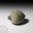Byzantine 'Greek Fire' Fire Bomb or Hand Grenade. 9th-11th century A.D. A hollow ceramic vessel with piriform body, short neck and domed mouth, decora...