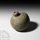 Byzantine 'Greek Fire' Fire Bomb or Hand Grenade. 9th-11th century A.D. A hollow ceramic vessel with rounded body, short neck and domed mouth; intende...