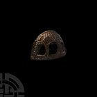 Scythian Zoomorphic Sword Pommel Cap. 1st millennium B.C. An openwork pommel cap featuring a stylised zoomorphic motif, the animal standing in an arch...