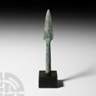 Luristan Socketted Spearhead. 13th-6th century B.C. A large spearhead with broad leaf-shaped blade, tapering tubular socket and bronze collar for fast...