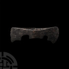 Byzantine Twin-Bladed Axehead. 10th-11th century A.D. An iron double axehead from Byzantium or Caucasus with square parallel blades, swept rear edge, ...