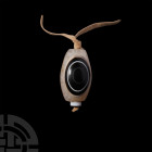 Agate Eye Bead Pendant. A Brazilian agate 'eye' bead on a fabric string. 57 grams, 45 mm (66 cm long) (1 3/4 in. (26 in.)). Acquired before the early ...