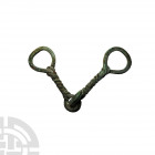 Eurasian Scythian Twisted Horse Bit. 8th century B.C. A bronze horse bit with round interlocking central rings, the bars spiralled and ending with sti...