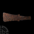 Iron Age Adze with Lugs. c.800 B.C. An iron flat adze blade of rectangular shape, with pronounced angular lugs and tapering rectangular butt. See simi...