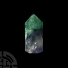 Large Fluorite Obelisk. A large fluorite obelisk with green, white and purple banding and rainbow reflections; supplied in a cardboard specimen tray. ...