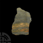 Unpolished Tiger's Eye Slab. An irregular and unpolished tiger's eye slab. 140 grams, 13.5 cm (5 1/4 in.) Mineral Imports, London, UK. Gregory, Bottle...