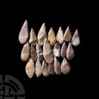 Large Stone Age Knapped Flint Arrowhead Collection. Neolithic, 8th-5th millennium B.C. A group of twenty large knapped arrowheads. 125 grams total, 34...