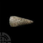 Stone Age Tenerian Ground Stone Axe. 8th-6th millennium B.C. A ground stone axe head with a tapering, lentoid-section body and convex cutting edge. 22...