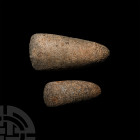 Stone Age Tenerian Culture Stone Axe Head Group. Neolithic, 8th-6th millennium B.C. A pair of pecked and ground stone axe heads, each with a tapering ...