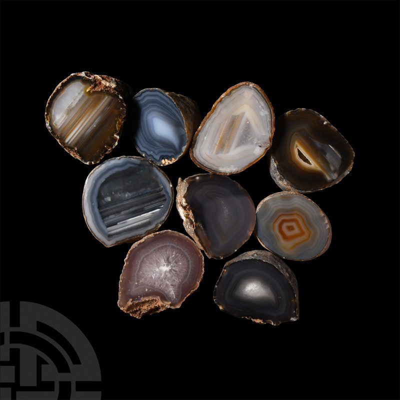 Cut and Polished Agate Geode Half Group. A group of nine cut and polished amethy...
