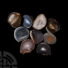 Cut and Polished Agate Geode Half Group. A group of nine cut and polished amethyst geode halves. 1.7 kg total, 61-71 mm (2 1/4 - 2 3/4 in.) Mineral Im...