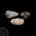 Stone Age Neolithic Tool Group. Neolithic, c.4th-2nd millennium B.C. A group of three flint tools comprising: an incomplete, re-worked and polished ax...