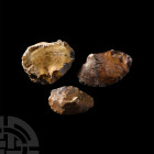 Stone Age Flint Tool Group. Palaeolithic, 200,000-100,000 B.P. A group of three flint tools comprising: a small bifacial pointed handaxe and two cleav...
