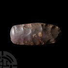 Stone Age Polished Flint Axehead. Neolithic, c.7200-4500 B.C. A Tenerean culture polished flint axehead with lentoid-section body, D-shaped cutting ed...