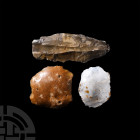 Stone Age Flint Tool Group. Palaeolithic-Mesolithic, 100,000-15,000 B.P. A group of three flint tools comprising: a leaf-shaped blade core implement; ...