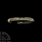 Bronze Age Bracelet. 2nd-1st millennium B.C. A penannular bronze bracelet with D-section hoop. 115 grams, 84 mm (3 1/4 in.) German art market, 1990s. ...
