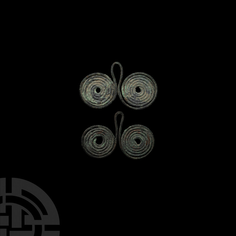 Bronze Age Coiled Spectacle Pendant Group. 16th-10th century B.C. A group of two...