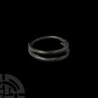 Bronze Age Coiled Bracelet. 13th-7th century B.C. A pair of two bronze bracelets, each composed of coiled round-section bodies and tapering terminals....