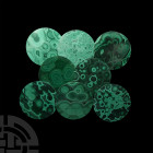 Malachite Coaster Group. A group of eight circular malachite coasters, averaging 4mm in thickness, all with numerous 'bullseye' patterns, un-backed. S...