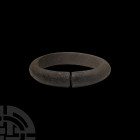 Bronze Age Decorated Bracelet. 2nd millennium B.C. A penannular bracelet with D-section body, decorated with clusters of engraved diagonal striations ...
