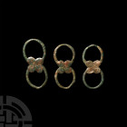 Bronze Age Strap Junction Group. 2nd millennium B.C. A group of strap junction elements comprising three double-looped fittings with central plaques f...