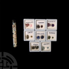 Rough and Cut Gemstone Collection. A collection of over sixteen gemstones, most held in a display box containing one rough and one cut sample of the s...