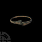 Bronze Age Bracelet with Trumpet Terminals. 11th-5th century B.C. A bronze penannular bracelet with D-section body and flared, rectangular-section tru...