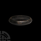 Bronze Age Decorated Bracelet. 2nd millennium B.C. A penannular bracelet with butting terminals, carinated body decorated with engraved diagonal stria...