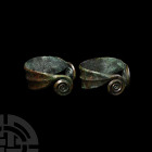 Bronze Age Coiled Bracelet Pair. c.10th-8th century B.C. A pair of penannular bronze bracelets, each with coiled and carinated terminals, raised upper...