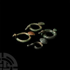 Iron Age Duck-Headed Clothes Toggle Collection. 15th-14th century B.C. A group of four clothes toggles, each composed of a ring with stylised duck's h...